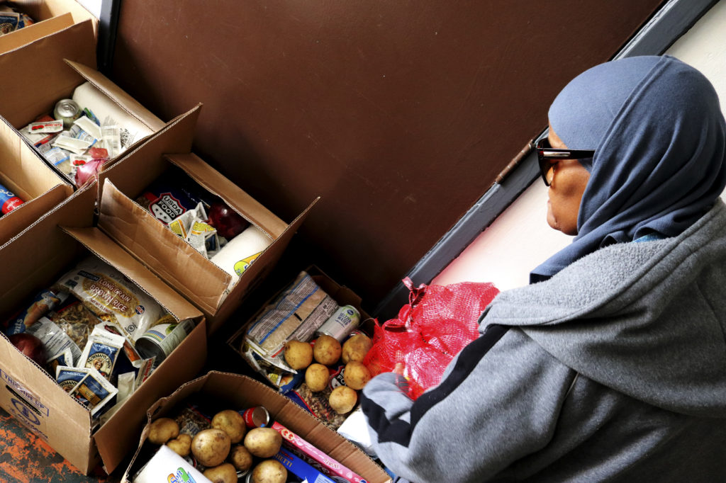 Aquillah Davis at work in Islah LA's food pantry.