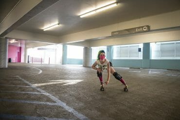 Mimi Masher stops for a photo while doing indoor speed runs at a parking garage.