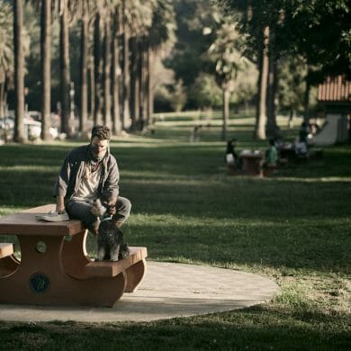 Rob Hyde pets his dog Arthur in Elysian Park.