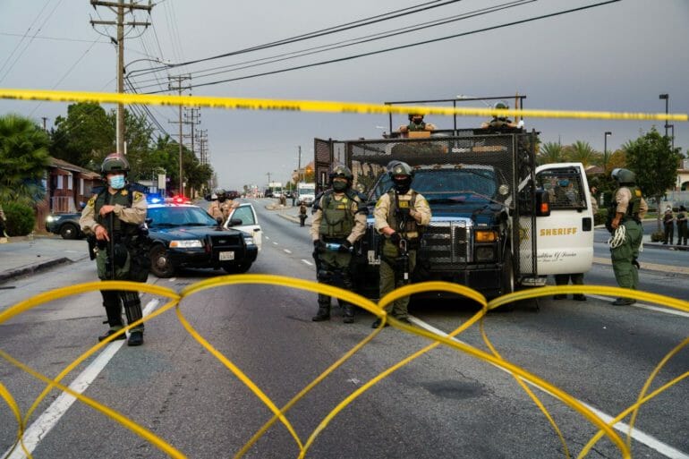 Los Angeles County Sheriff’s deputies block off a section of Imperial Highway in front of the South Los Angeles Sheriff Station on Sept. 9, 2020 during a protest condemning the sheriffs’ killing of Dijon Kizzee and the department’s use of force against protesters.