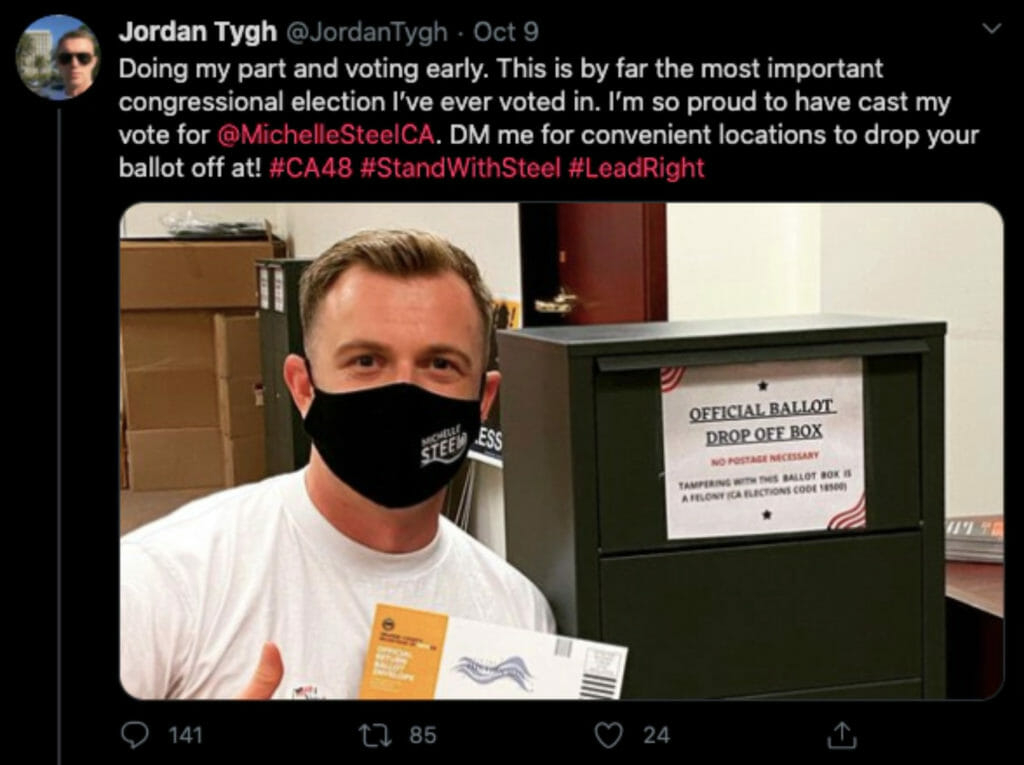 A screenshot of a Tweet that includes an image of a man posing next to an unofficial ballot box. The tweet reads, "Doing my part and voting early. This is by far the most important congressional election I've ever voted in. I'm so proud to have cast my vote for @MichelleSteelCA. DM me for convenient locations to drop your ballot off at! #CA48 #StandWithSteel #LeadRight" and was posted by @JordanTygh.