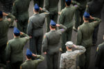 Members of the 374th Operations Group salute during a retreat ceremony March 17, 2017, at Yokota Air Base, Japan.